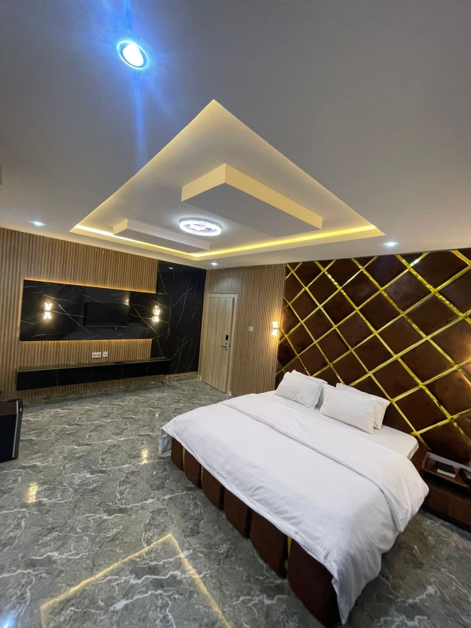 A made-up bedroom in an Oak Haven suite